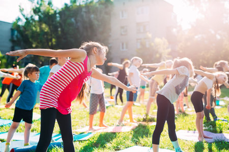 Yoga classes outside on the open air. Kids Yoga,