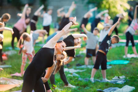 Yoga classes outside on the open air. Kids Yoga,の写真素材