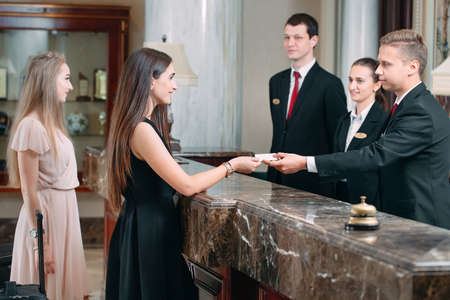 Picture of guests getting key card in hotel.の写真素材
