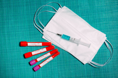 The vaccine for Coronavirus. Positive blood Tests for Coronavirus in test tubes.