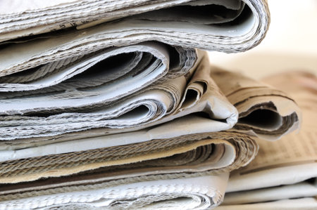 stack of folded newspapers