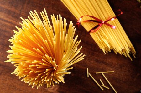 composition of spaghetti on the wood table top viewの写真素材