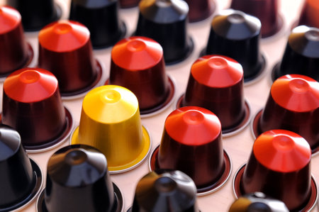 set of espresso coffee capsules for machine aligned diagonally on a tableのeditorial素材