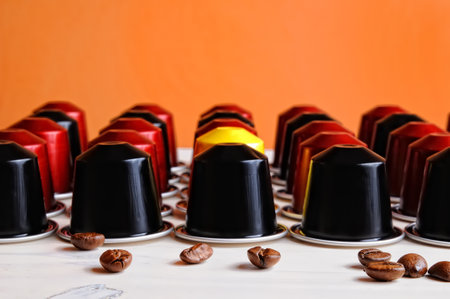 set of espresso coffee capsules for machine aligned on a tableのeditorial素材