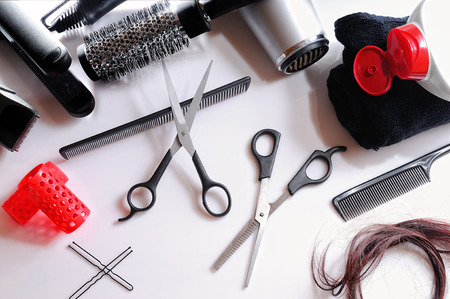 Horizontal composition hairdressing tools on a white table and white background isolated top viewの写真素材