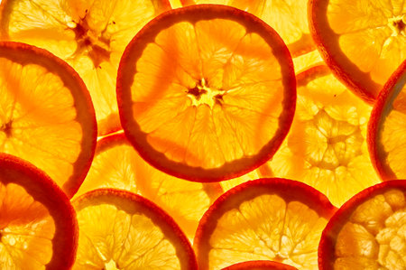 Group of orange slices against the light. Close up.Top view