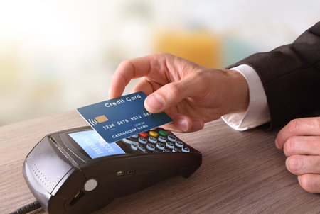Payment on a trade through mobile and NFC technology. Elevated view. Horizontal composition.