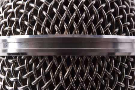 Detail of silver metal microphone grille. Front view. Horizontal compositionの写真素材