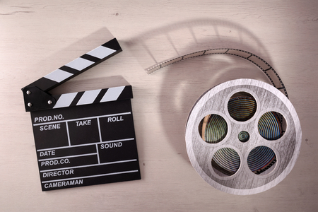 Clapper open on wooden table. Concept of editing and production of videos. Horizontal composition Top viewの写真素材