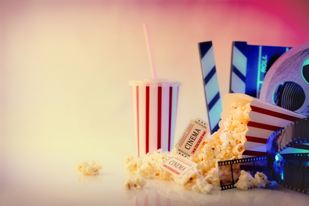 Conceptual objects of cinema on white table and background. Concept of watching movies. Horizontal composition. Front view.の写真素材