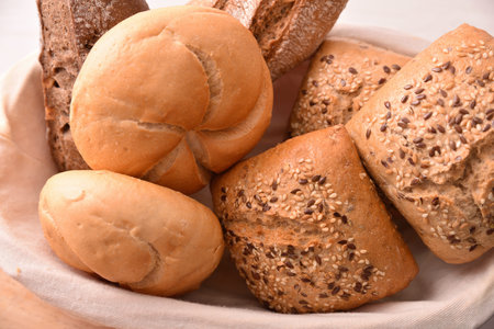 Different types of bread on a bread basket. Top view. Horizontal composition