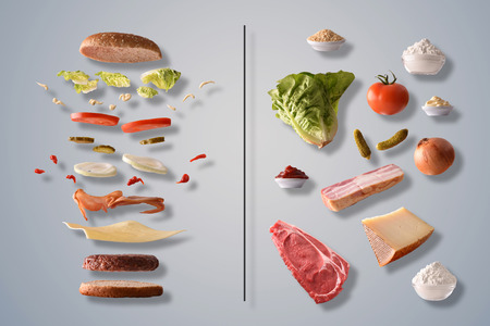 Illustrative composition of a burger broken down into layers on the left and ingredients on the right on gray gradient isolated background. Front view. Horizontal composition.の写真素材
