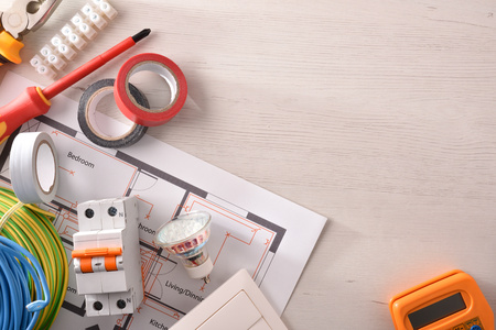 Equipment on white wooden table for electrical installation of housing with space on the right. Horizontal composition. Top view.の写真素材