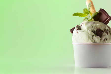 Mint ice cream cup on table isolated close up. Horizontal composition. Front view.の写真素材
