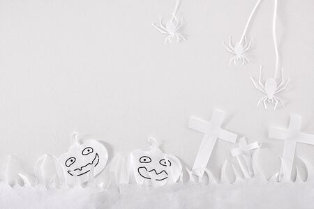 Fun Halloween composition with paper cutouts on white table. Horizontal composition.の写真素材