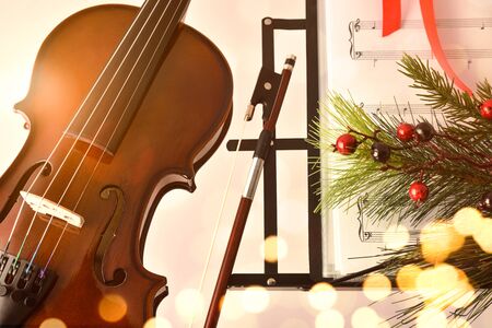Christmas concert concept with violin and music stand and decorationの写真素材