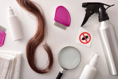 White table of a hair health center with products and accessories for treating lice. Horizontal...