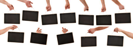 Set of hands picking up hanging blackboard signs by pita rope in different positions with white isolated backgroundの写真素材