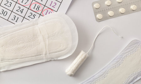 Menstrual products package, calendar with marked critical days tampons and padsの写真素材