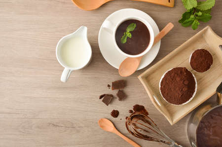Preparing hot chocolate recipe with lingredientes on kitchen table. Top view.の写真素材