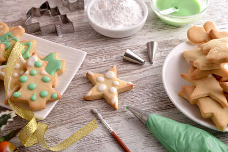 Tools for painting Christmas cookies with icing close up. Elevated view. Horizontal composition.の写真素材