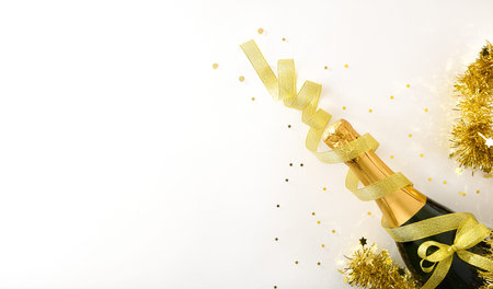 Christmas season party concept with ball and gift bottle with golden and white tones. Top viewの写真素材