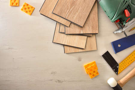 Parquet slats and tools for DIY at home on wood table top. Top view. Horizontal composition.の写真素材