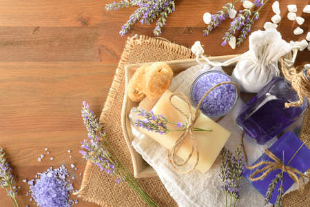 Set of natural lavender body care products on wooden table. Top view. Landscape composition.の写真素材