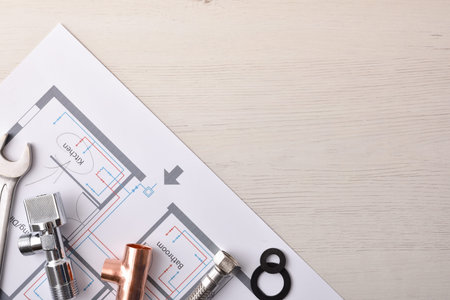 Conceptual background of elements of water installation in housing with plans and plumbing material...