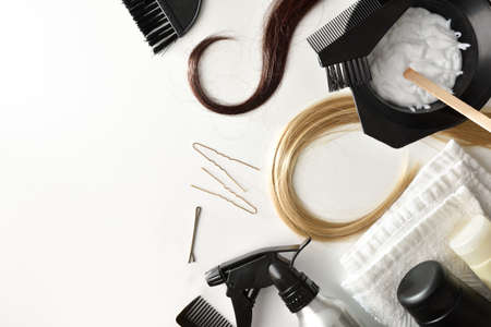 Set of hair care and coloring products from a stylist salon on white table. Top view. Landscape composition.の写真素材