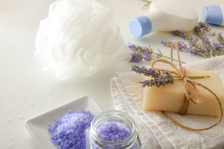 Bath products with lavender extract with elements for personal hygiene on white table. Elevated view. Horizontal composition.の写真素材