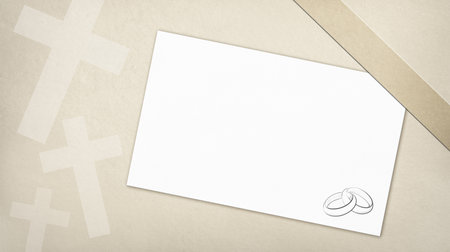 Illustrative religious wedding background with textured brown paper effect with designs of catholic crosses and blank card with drawing of alliances.の写真素材