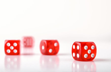 Detail of dice background for playing games of chance with several red transparent plastic dice...