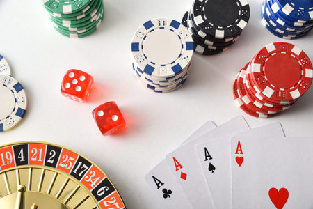 Casino games background isolated on white table with playing cards, betting chips and dice for...