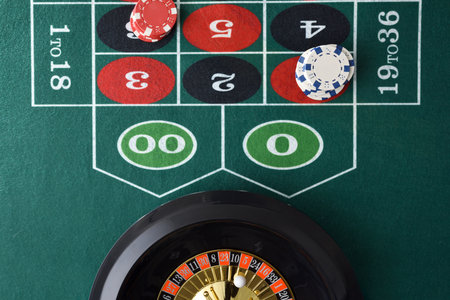 Detail of roulette game table with chips betting on numbers and roulette. Top view.の写真素材