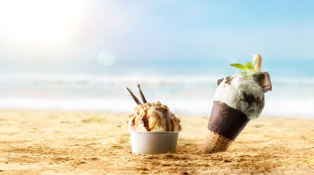 Background with cone and cup of ice cream to cool off on the sand on a hot sunny beach. Front view.