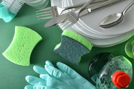 Background with product, tools, dishes and cutlery on green background. Hand washing and hygiene concept. Top view.の写真素材