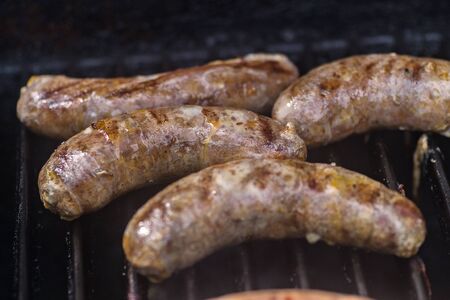 grilled sausages on grillの写真素材