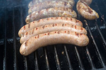 grilled sausages on grillの写真素材