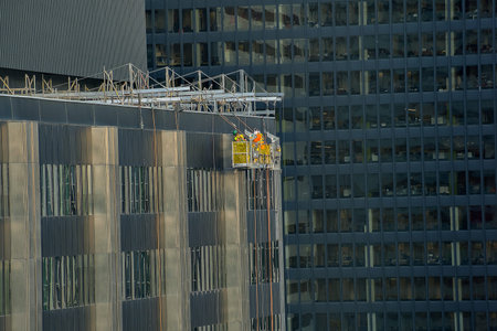 Window washers on building
