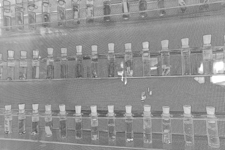 A black and white sketch of test tubes.