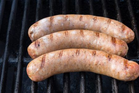 Grilled sausages on a barbecue grill. Selective focus.の写真素材