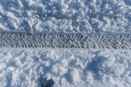 Tyre tracks on the snow in winter. Close-up.の写真素材