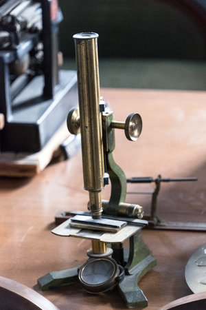 Close up view of a vintage mechanical microscope.の写真素材