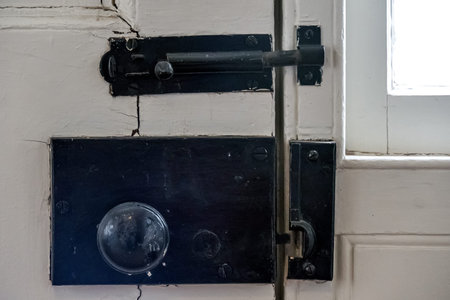 Old lock on the door of an old house, vintage style.