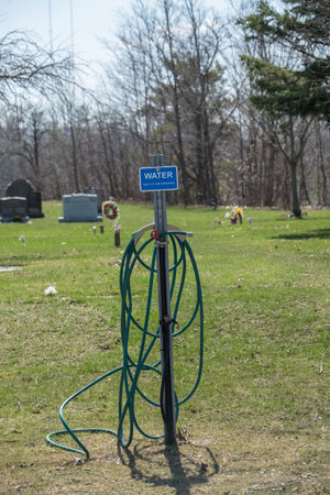 Garden sprinkler in a public park in the springtime.の写真素材