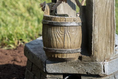 Wooden water well in the park, close-up, selective focusの写真素材