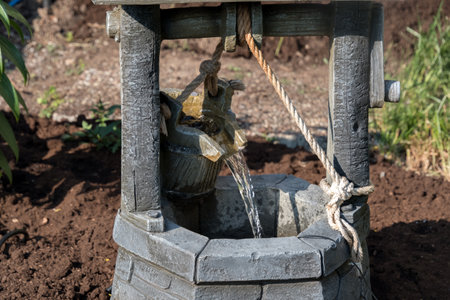 Water well in the garden, close-up. Water supply in the garden.の写真素材