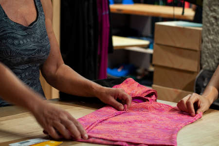 Seller at work in a sport storeの写真素材
