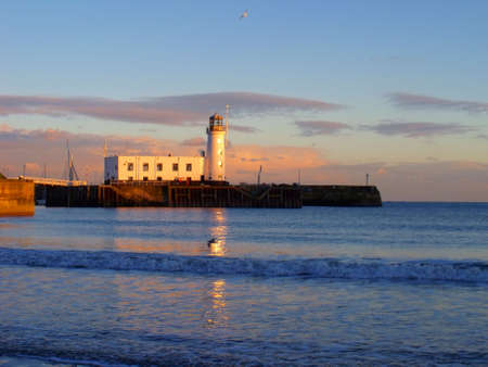 Lighthouse at Sunset Scarborough Englandの写真素材